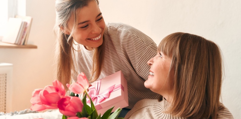 Woman giving her mum a gift for Mother’s Day