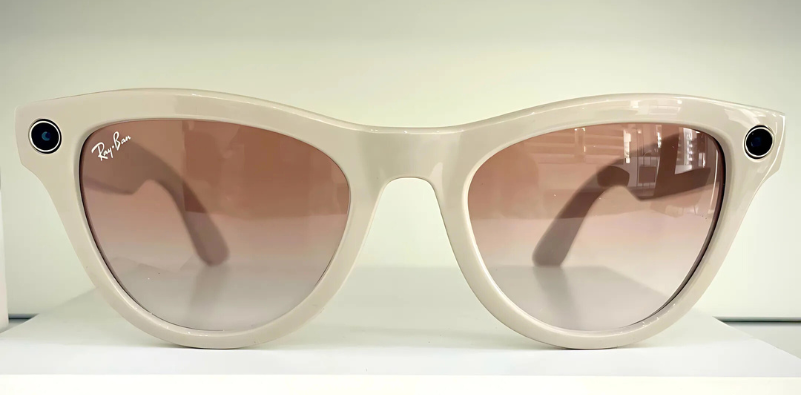 Close-up of beige Ray-Ban Meta smart sunglasses with pink lenses