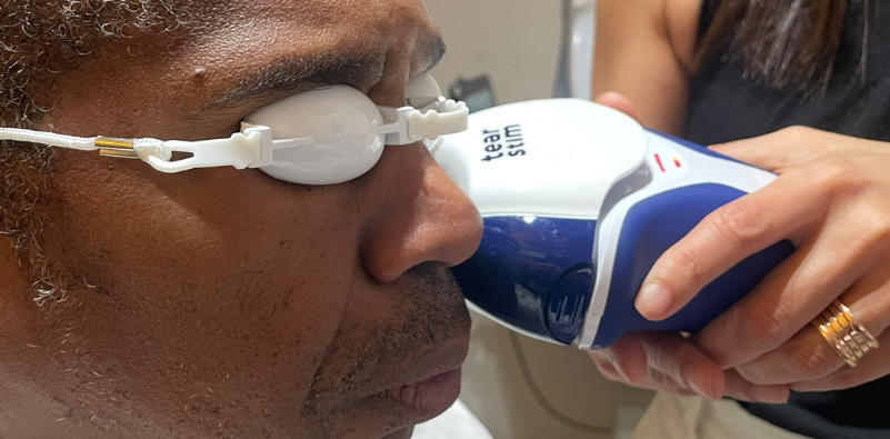 Man receiving TearStim treatment for dry eyes
