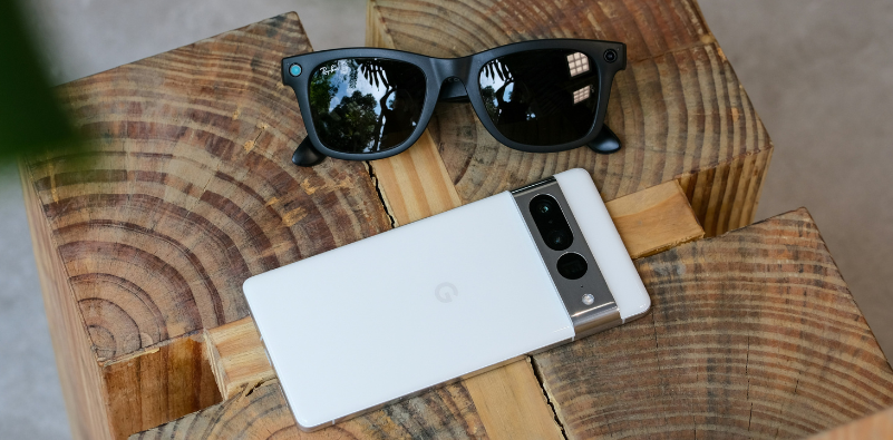 black Ray-Ban Meta smart sunglasses next to smartphone