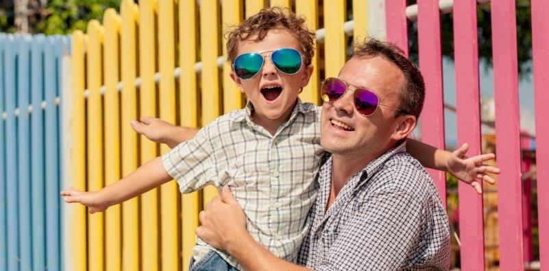 Parent and child playing and wearing sunglasses