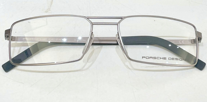 Metal pilot-style Porsche Design glasses crafted with precision engineering.]