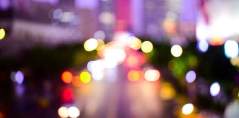 A visual representation of astigmatism, showing blurred lights on the street at night