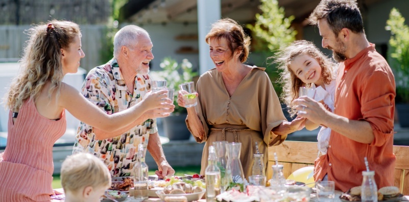 A multi-generational family having a garden party.