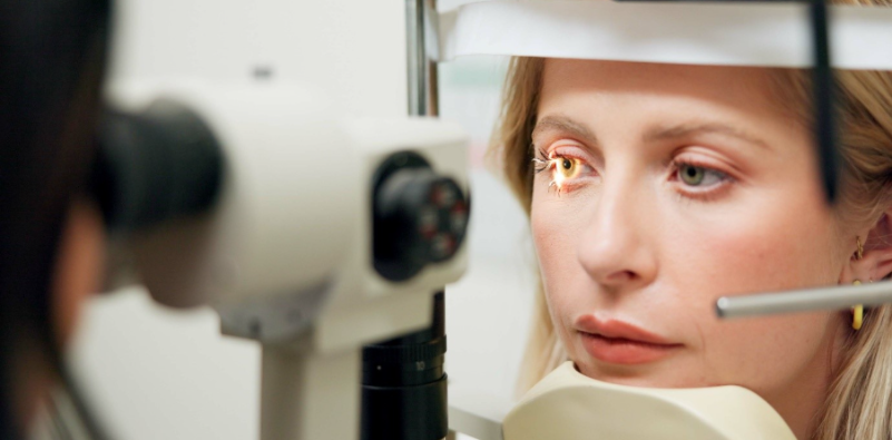 A woman having an eye test at the opticians