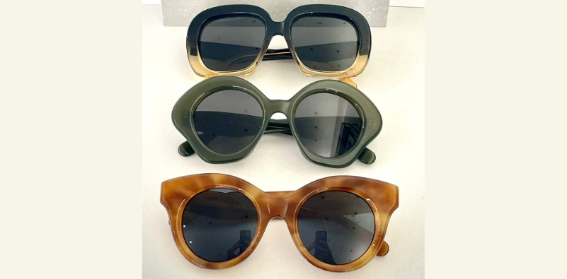 A row of three different coloured and shaped LOEWE sunglasses at Optikal Opticians